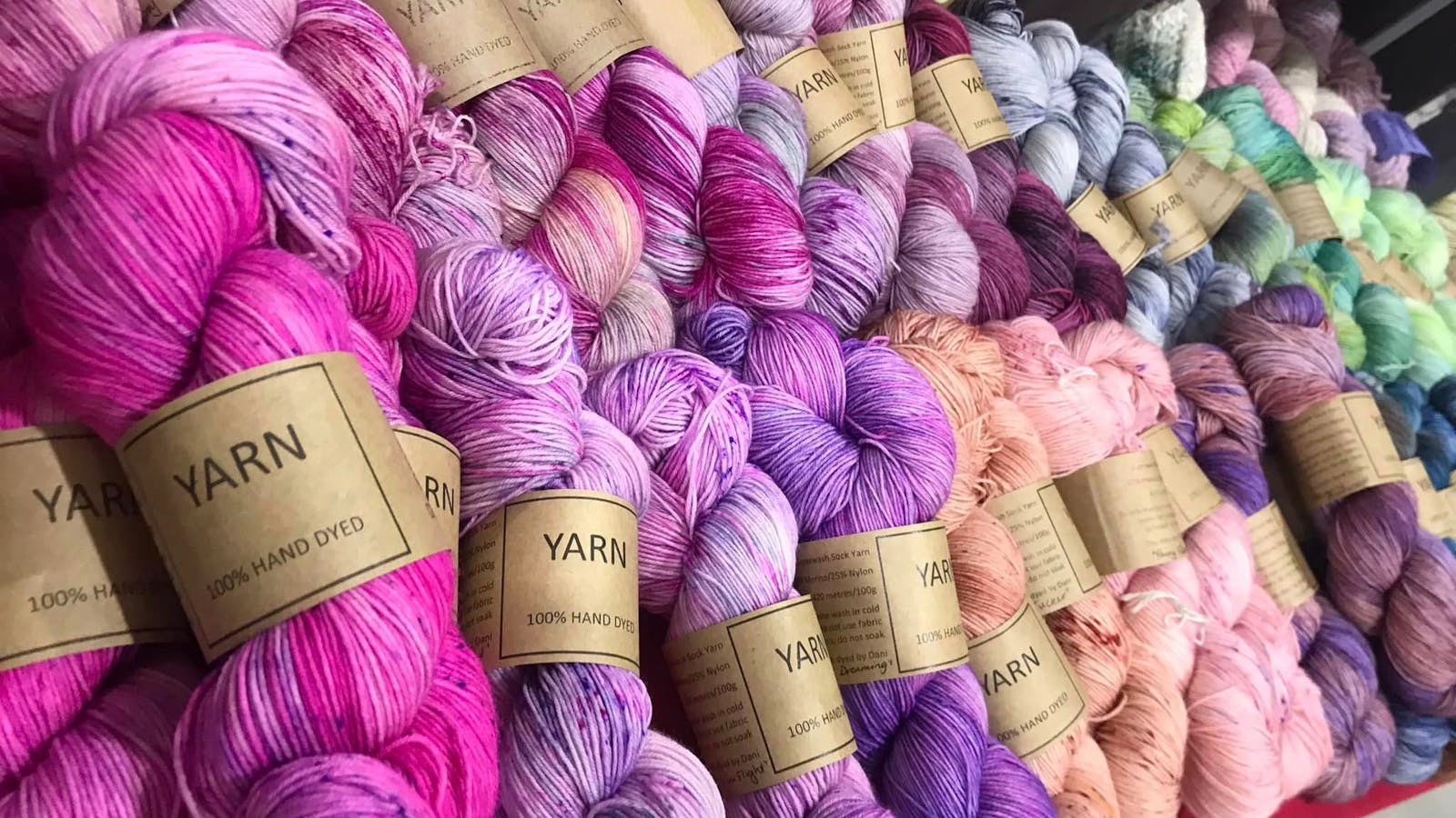 an array of coloured dyed yarn on display