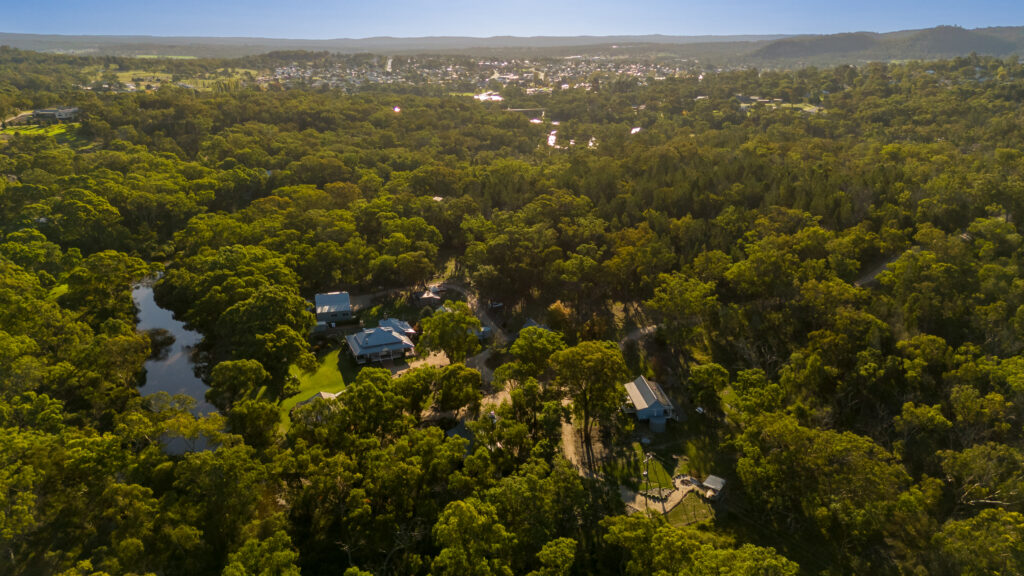 Aerial view of Diamondvale Estate that shows the creek and bushland setting and the CBD of Stanthorpe in the background