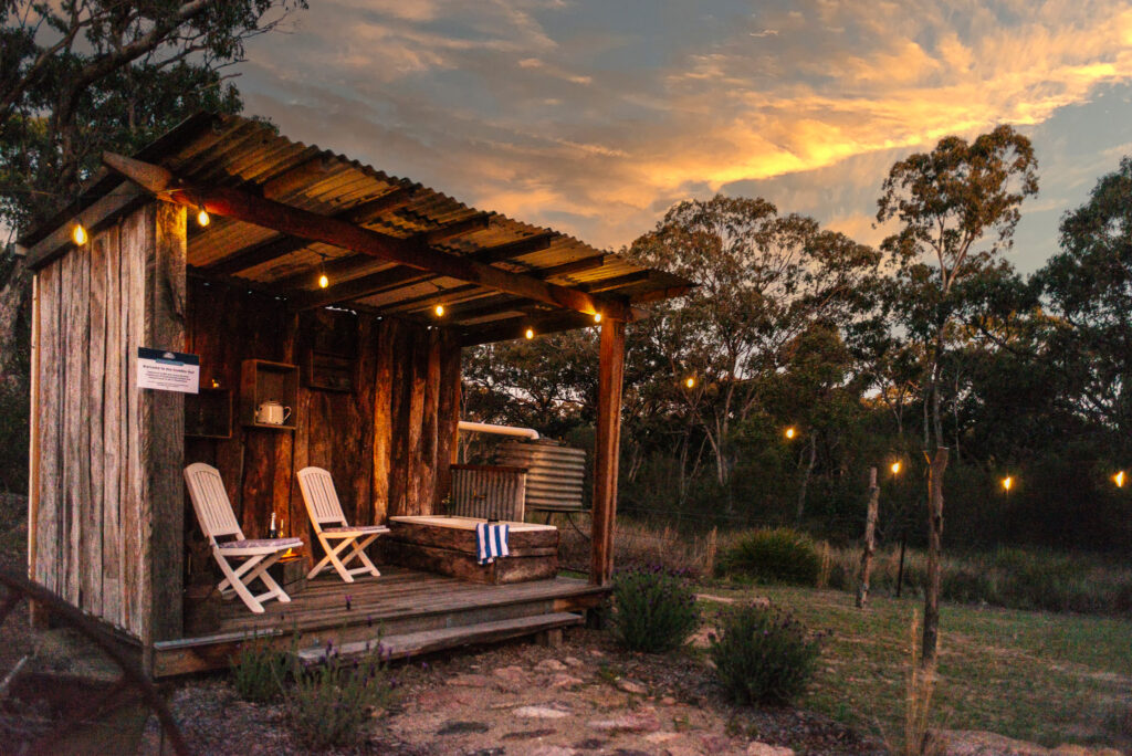 Humble Hut is a timber structure with seats and an outdoor bath